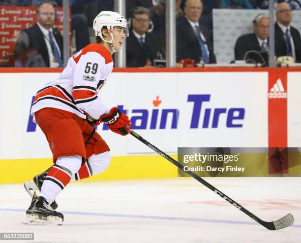 Janne Kuokkanen of the Carolina Hurricanes follows the play up the ice during third period action against the Winnipeg Jets at the Bell MTS Place on...