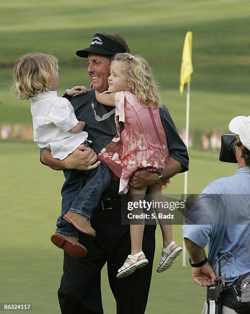 Phil Mickelson holding his son Evan and daughter Sophia, after winning the final round of the BellSouth Classic at TPC Sugarloaf in Duluth, Georgia,...