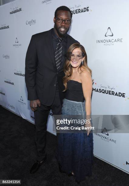 Player Jason Paul Pierre and Care One Executive Vice President Lizzy Straus attend Daniel E Straus & CareOne Starry Night Masquerade For Puerto Rico...