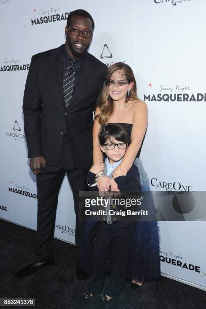 Player Jason Paul Pierre and Care One Executive Vice President Lizzy Straus attend Daniel E Straus & CareOne Starry Night Masquerade For Puerto Rico...