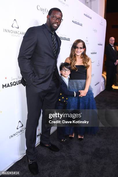 Player Jason Pierre Paul and Care One Executive Vice President Lizzy Straus attend Daniel E Straus & CareOne Starry Night Masquerade For Puerto...