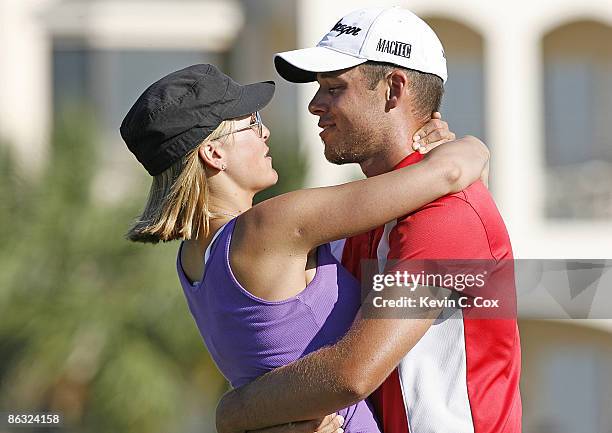 Aaron Baddeley hugs his wife Richelle on the 18th green after winning the 2006 Verizon Heritage Classic Sunday, April 16 at Harbour Town Golf Links...