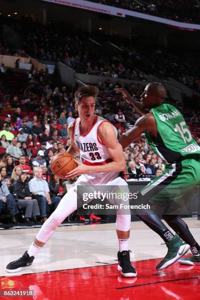 Zach Collins of the Portland Trail Blazers handles the ball during the preseason game against the Maccabi Haifa on October 13, 2017 at the Moda...