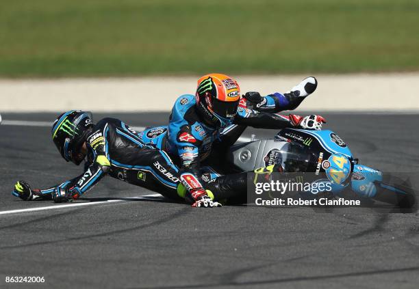 Nicolo Bulega of Italy and riding the Sky Racing Team VR46 KTM crashes into Aron Canet of Spain and rider of the Estrella Galicia 0,0 Honda during...