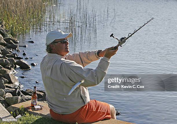 Darren Clarke enjoys a little fishing after the 2006 Verizon Heritage Monday Pro-Am April 10 at Harbour Town Golf Links in Hilton Head Island, South...