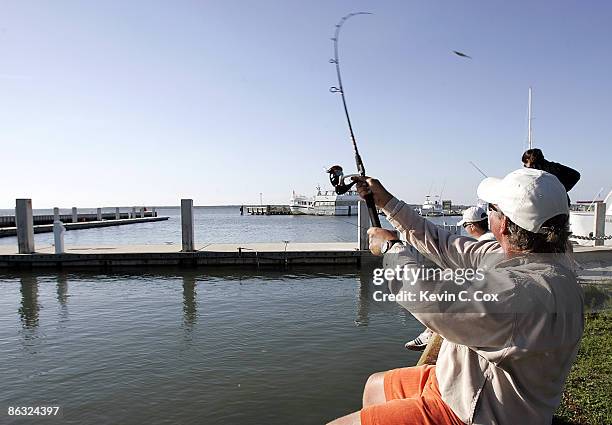 Darren Clarke enjoys a little fishing after the 2006 Verizon Heritage Monday Pro-Am April 10 at Harbour Town Golf Links in Hilton Head Island, South...