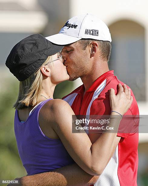 Aaron Baddeley kisses his wife Richelle on the 18th green after winning the 2006 Verizon Heritage Classic Sunday, April 16 at Harbour Town Golf Links...