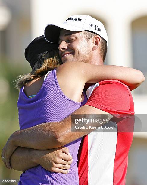 Aaron Baddeley hugs his wife Richelle on the 18th green after winning the 2006 Verizon Heritage Classic Sunday, April 16 at Harbour Town Golf Links...