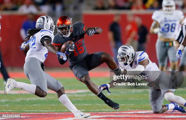 Linell Bonner of the Houston Cougars takes a hit from Tito Windham of the Memphis Tigers and Tyrez Lindsey after a reception on October 19, 2017 in...