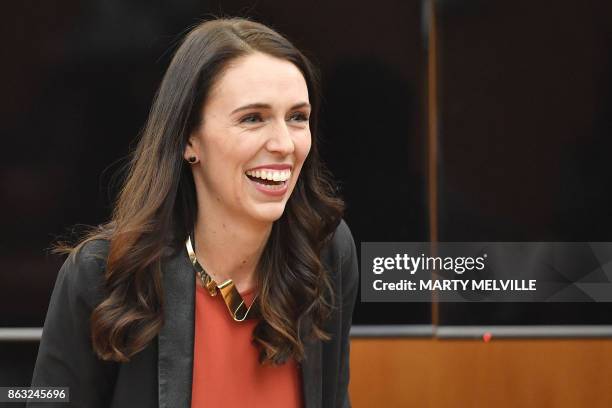 New Zealand's Labour party leader Jacinda Ardern receives applause as she is welcomed to her first caucus meeting as Prime Minister-elect at...