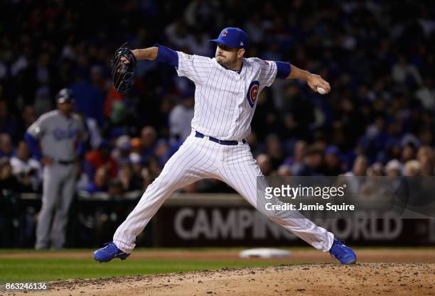 Brian Duensing of the Chicago Cubs pitches in the sixth inning against the Los Angeles Dodgers during game five of the National League Championship...