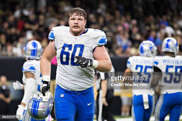Graham Glasgow of the Detroit Lions jogs off the field during a game against the New Orleans Saints at Mercedes-Benz Superdome on October 15, 2017 in...