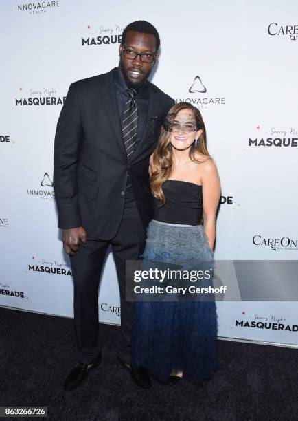 Player Jason Pierre- Paul and CareOne Executive Vice President Lizzy Straus attend the 2017 CareOne Masquerade Ball for Puerto Rico Relief Effort at...