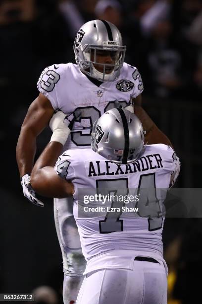 DeAndre Washington of the Oakland Raiders celebrates after a touchdown with Vadal Alexander during their NFL game against the Kansas City Chiefs at...