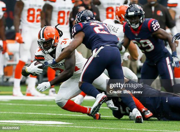 Isaiah Crowell of the Cleveland Browns tackled by Benardrick McKinney of the Houston Texans and Marcus Gilchrist at NRG Stadium on October 15, 2017...