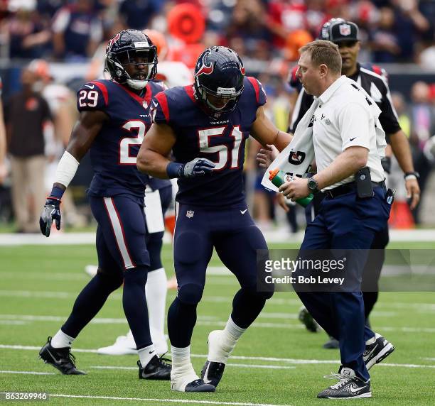 Dylan Cole of the Houston Texans limps off the field after injuring his hamstring on an interception against the Cleveland Browns at NRG Stadium on...