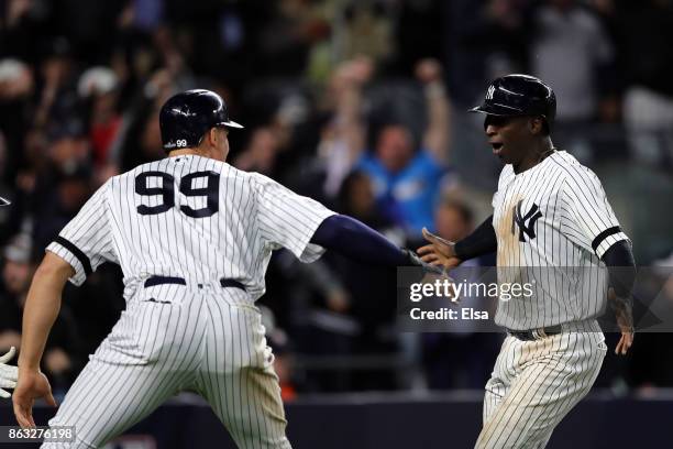 Didi Gregorius and Aaron Judge of the New York Yankees celebrate after scoring in the eighth inning against the Houston Astros during Game Four of...