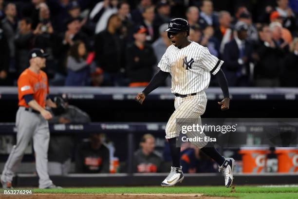 Didi Gregorius of the New York Yankees celebrates as he scores in the eighth inning against the Houston Astros during Game Four of the American...