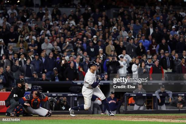 Aaron Judge of the New York Yankees hits a double in the eighth inning against the Houston Astros during Game Four of the American League...