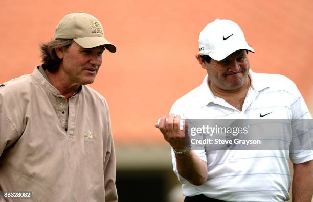 Kurt Russell and Mike Eruzione in action during round one of the 46th Bob Hope Chrysler Classic Celebirty Pro-Am at Bermuda Dunes Country Club in...