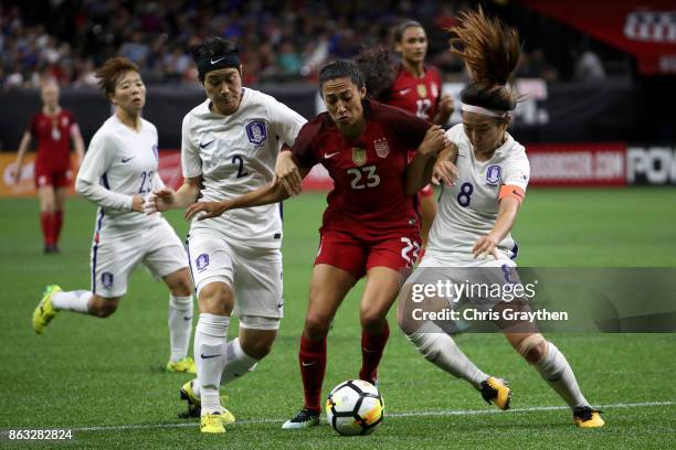 Christen Press of the USA fights for the ball with Sohyun Cho of the Korea Republic at the Mercedes-Benz Superdome on October 19, 2017 in New...