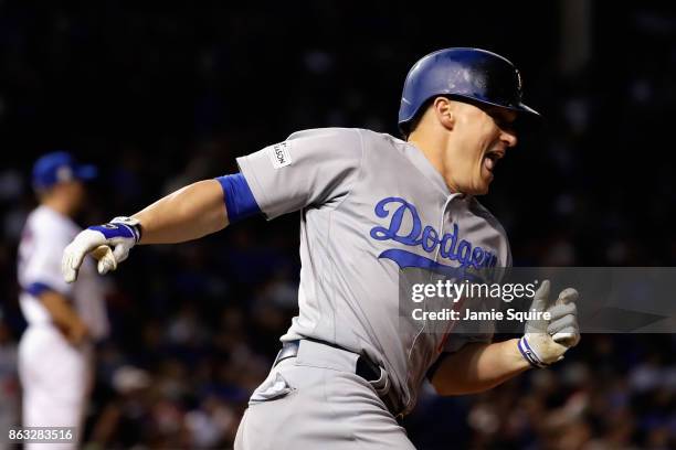 Enrique Hernandez of the Los Angeles Dodgers celebrates after hitting a two-run home run in the ninth inning against the Chicago Cubs during game...