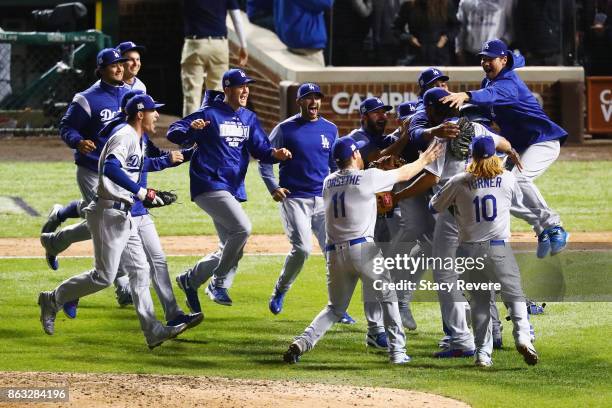 The Los Angeles Dodgers celebrate defeating the Chicago Cubs 11-1 in game five of the National League Championship Series at Wrigley Field on October...