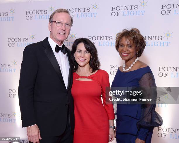 Neil Bush and his wife, Maria, with Natalye Paquin, CEO of Points of Light, attend the 2017 Points of Light Gala at the French Embassy on October 19,...