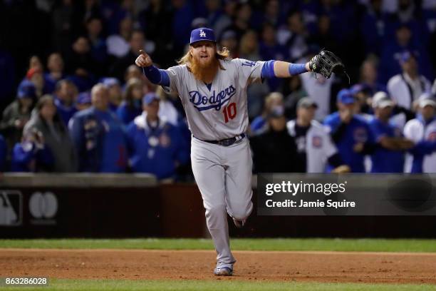 Justin Turner of the Los Angeles Dodgers celebrates after beating the Chicago Cubs 11-1 in game five of the National League Championship Series at...