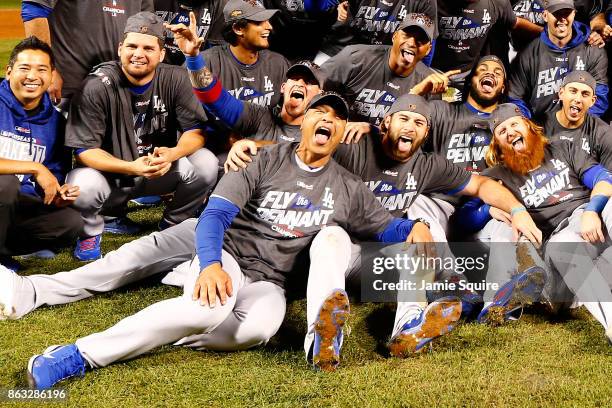 The Los Angeles Dodgers pose after defeating the Chicago Cubs 11-1 in game five of the National League Championship Series at Wrigley Field on...