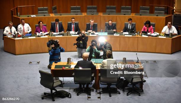 Members of the media gather as Ian Narev, chief executive officer of Commonwealth Bank of Australia , left, and Catherine Livingstone, chairman,...