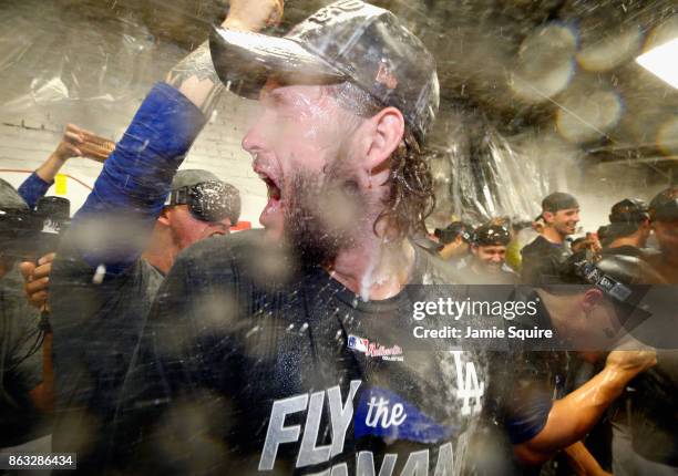 Clayton Kershaw of the Los Angeles Dodgers celebrates in the clubhouse after defeating the Chicago Cubs 11-1 in game five of the National League...