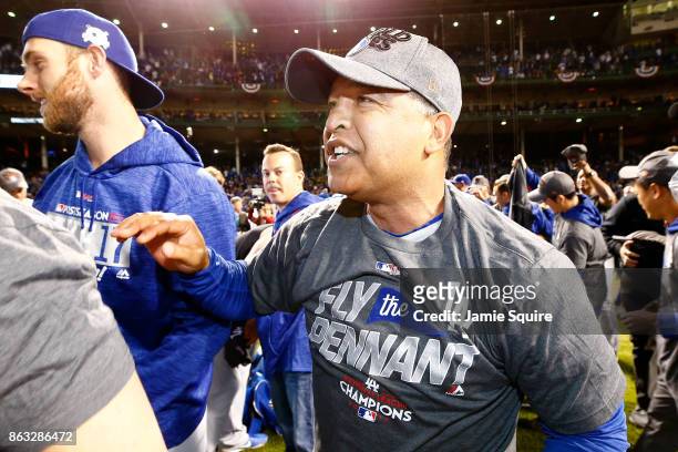 Manager Dave Roberts of the Los Angeles Dodgers celebrates after beating the Chicago Cubs 11-1 in game five of the National League Championship...