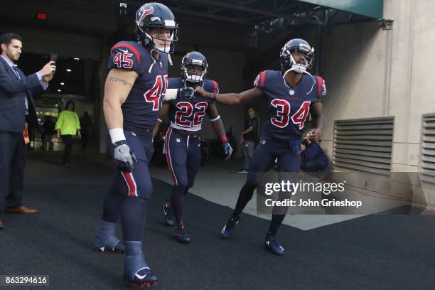 Jay Prosch, Jordan Todman and Tyler Ervin of the Houston Texans prepare to take the field before their game against the Cincinnati Bengals at Paul...