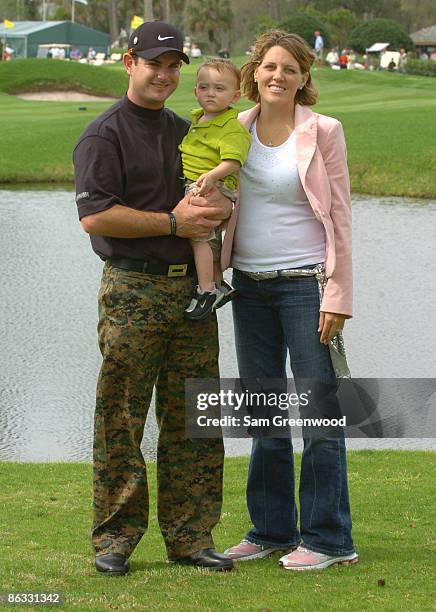 Rory Sabbatini with son Harley Aiden and wife Amy wearing camouflage pants in support of the troops in Afghanistan and Iraq during practice for THE...