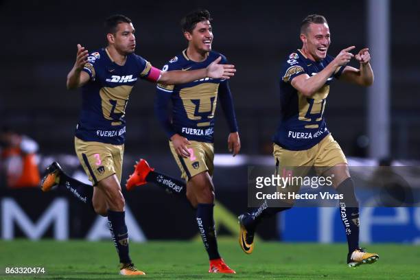 Abraham Gonzalez of Pumas celebrates with teammates after scoring the first goal of his team during the 10th round match between Pumas UNAM and Leon...