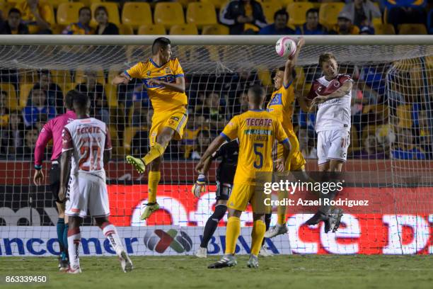 Timothee Kolodziejczak of Tigres blocks the ball with the hand during the 10th round match between Tigres UANL and Veracruz as part of the Torneo...