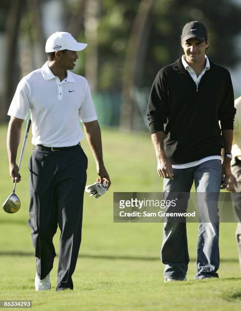 Tiger Woods and Roger Federer during a practice round at the CA Championship held at the Doral Resort and Spa on the Blue Monster Course in Miami,...