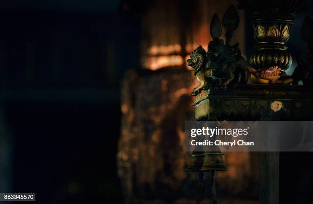bronze lion at indian temple - altar stock pictures, royalty-free photos & images