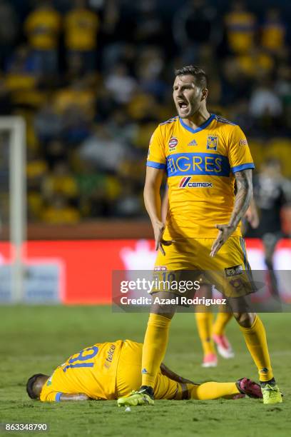 Andre Gignac of Tigres reacts while teammate Ismael Sosa lies on the ground during the 10th round match between Tigres UANL and Veracruz as part of...