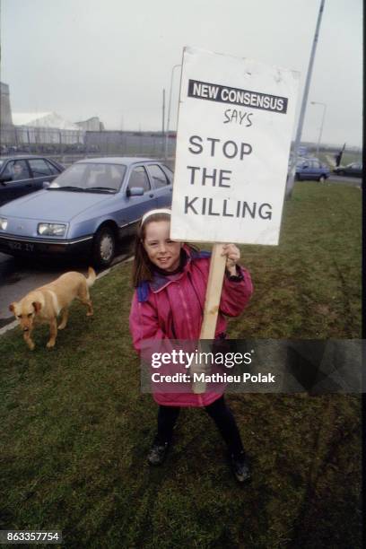 Sinn FÃ©in conference and anti-terrororism demonstration in Dublin- a little girl carrying a placard with the writing "Stop the killing"