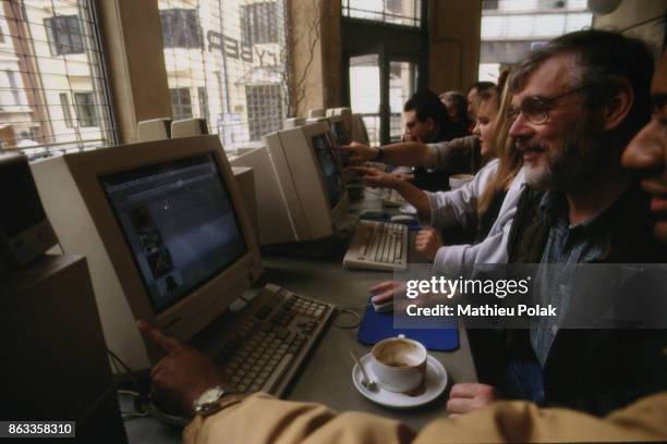 VIRTUAL' SURFERS AT THE CYBERIA CAFÃ‰ IN LONDON