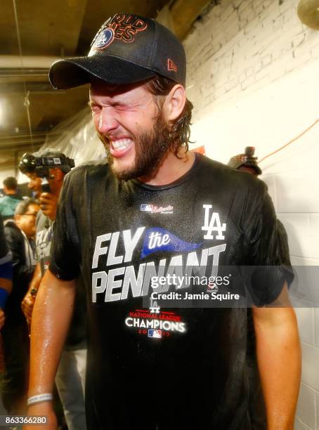 Clayton Kershaw of the Los Angeles Dodgers celebrates in the clubhouse after defeating the Chicago Cubs 11-1 in game five of the National League...