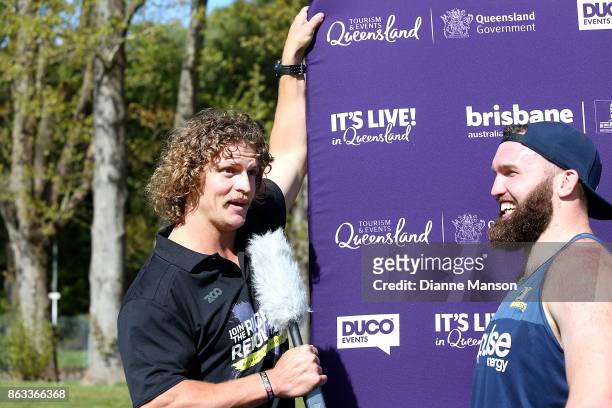 Nick Cummins interviews Liam Coltmans of the Highlanders after taking part in a sheep shearing contest on October 20, 2017 in Dunedin, New Zealand.