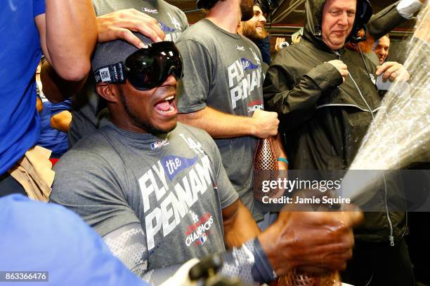 Yasiel Puig of the Los Angeles Dodgers celebrates in the clubhouse after defeating the Chicago Cubs 11-1 in game five of the National League...