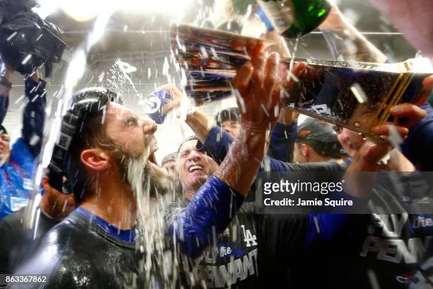 Chris Taylor of the Los Angeles Dodgers celebrates in the clubhouse after defeating the Chicago Cubs 11-1 in game five of the National League...