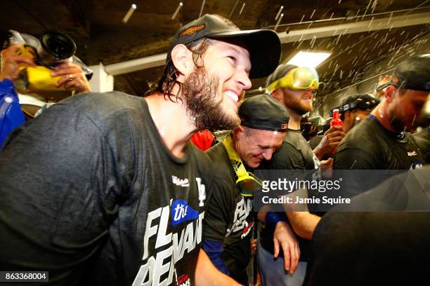 Clayton Kershaw of the Los Angeles Dodgers celebrates in the clubhouse after defeating the Chicago Cubs 11-1 in game five of the National League...
