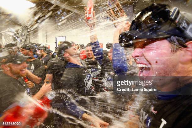 Rich Hill of the Los Angeles Dodgers celebrates in the clubhouse after defeating the Chicago Cubs 11-1 in game five of the National League...