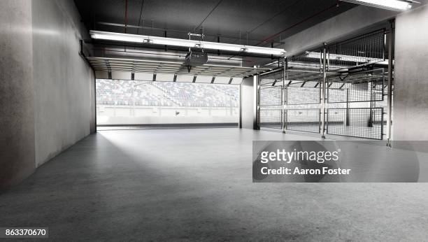 empty pit garage - pit stop stock pictures, royalty-free photos & images