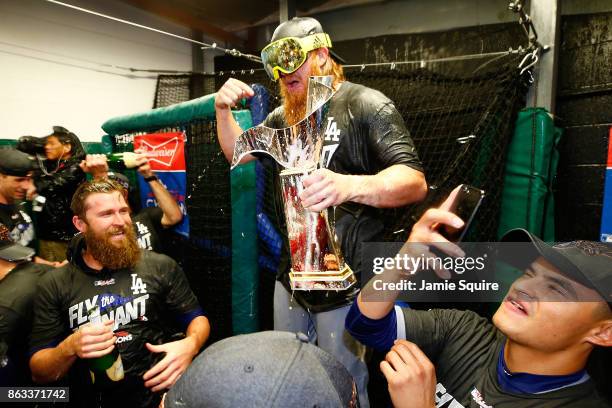 Justin Turner of the Los Angeles Dodgers celebrates in the clubhouse after defeating the Chicago Cubs 11-1 in game five of the National League...